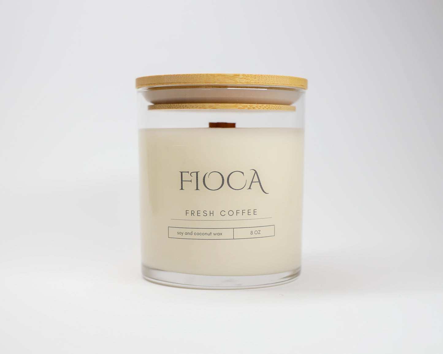 Close-up product image of Fioca Fresh Coffee candle in front of a white backdrop, showcasing sustainable design and handcrafted detail