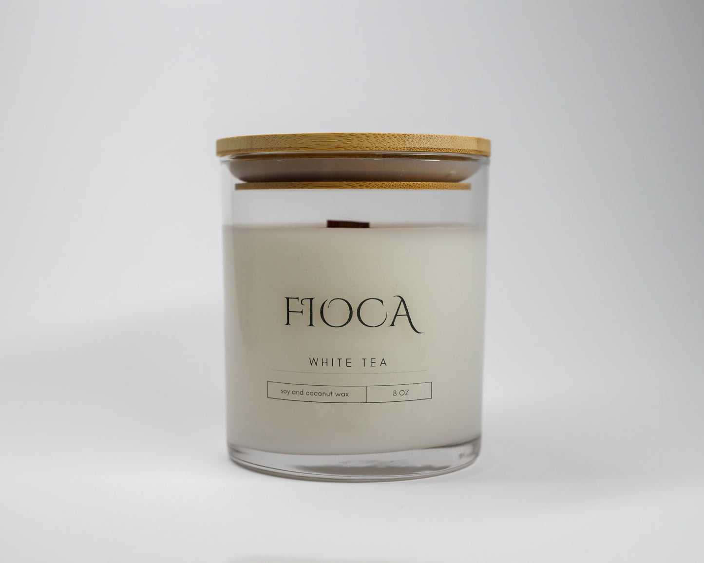 Fioca White Tea candle presented against a plain background, emphasizing the brand’s elegant and toxin-free coconut soy wax formulation