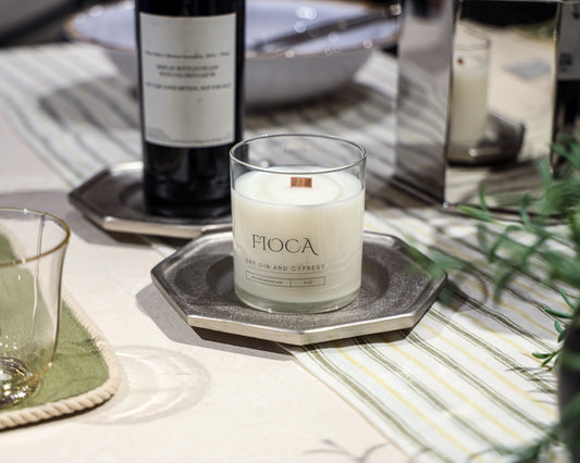 Fioca Dry Gin and Cypress candle styled as part of a refined dinner table setup, blending sensory ambiance with elegant entertaining